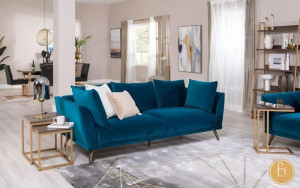 Một chiếc ghế sofa màu xanh trong phòng sẽ mang năng lượng tích cực đến cho bạn